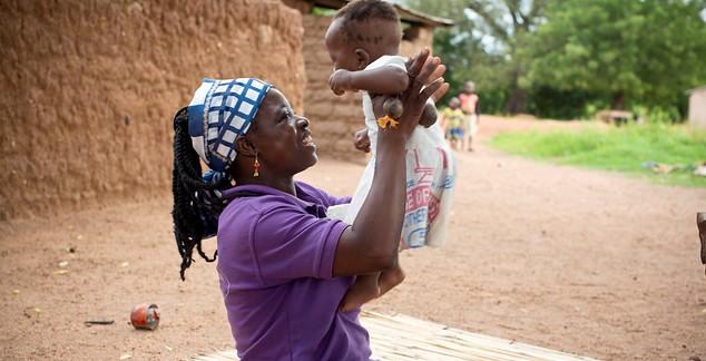 laughing woman with baby