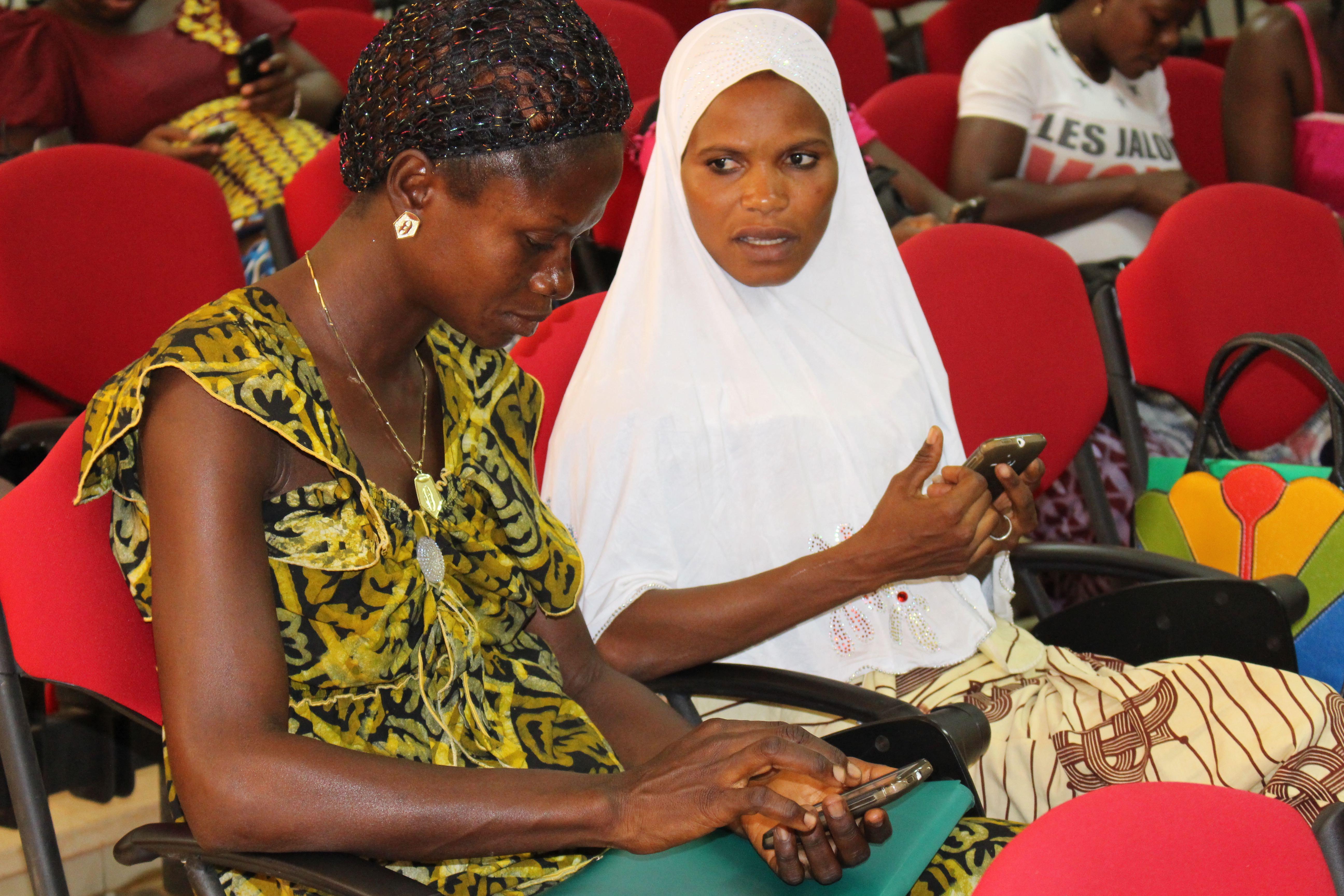 Two women sitting together and in discussion 